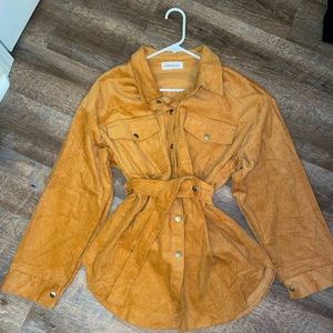 Corduroy golden long-length shirt.